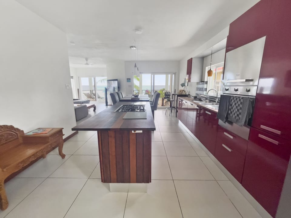 Scavolini Kitchen with island and dining area. 