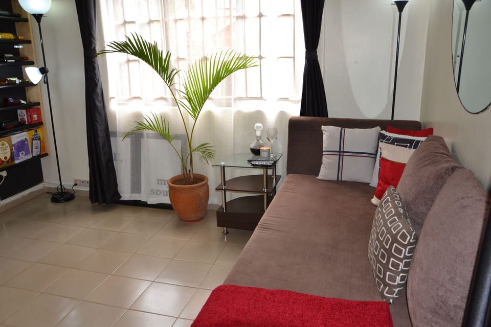 Comfy 3 seater sofa with a red throw