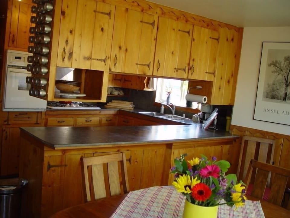 Connecting kitchen and dining room with seating for eight.