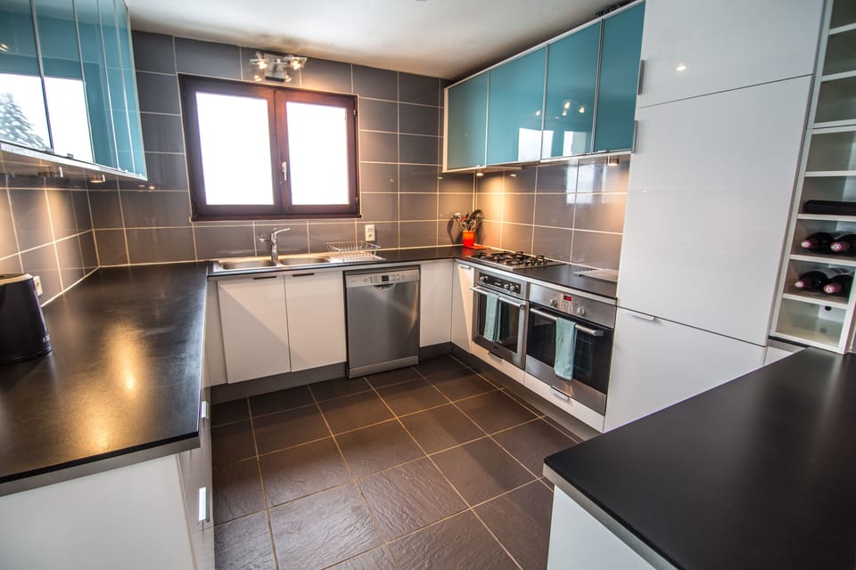 Kitchen with plenty of workspace and dishwasher