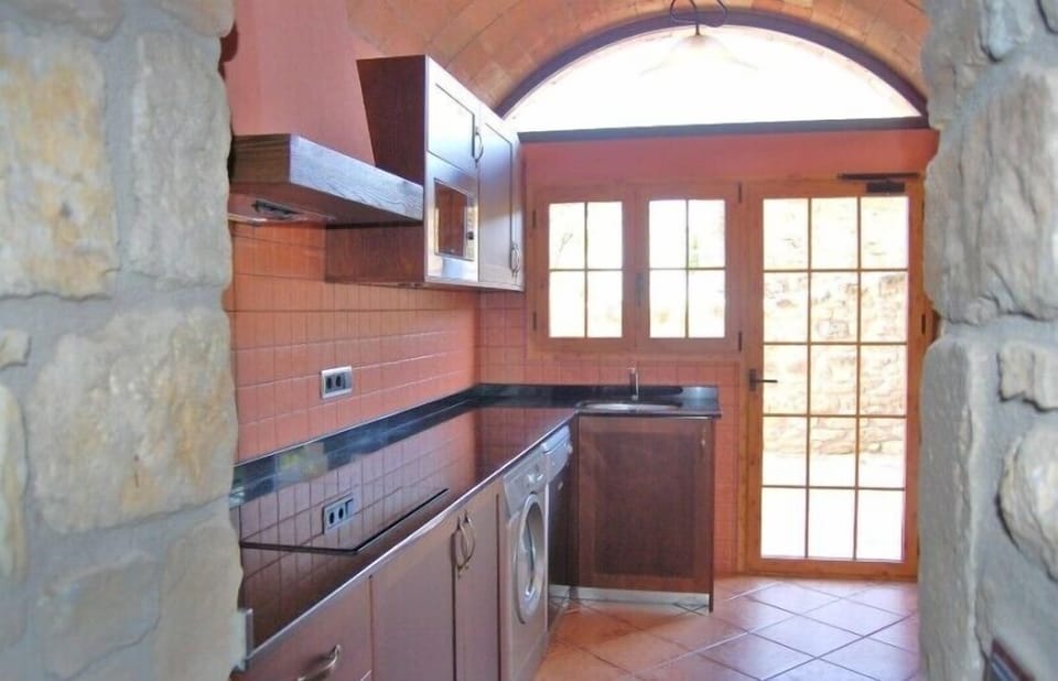There is 2 kitchens, both with all modern utensils