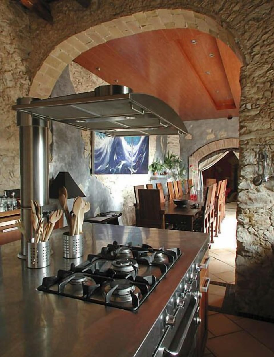 a well equipped and modern kitchen leading to the dining room