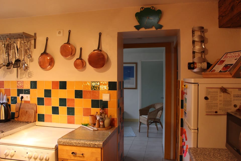 Kitchen leading to a larder, separate WC & downstairs bathroom.