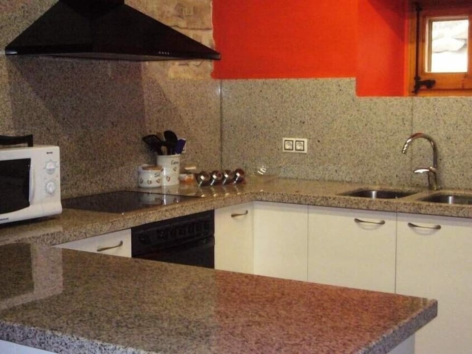 The kitchen is large and modern