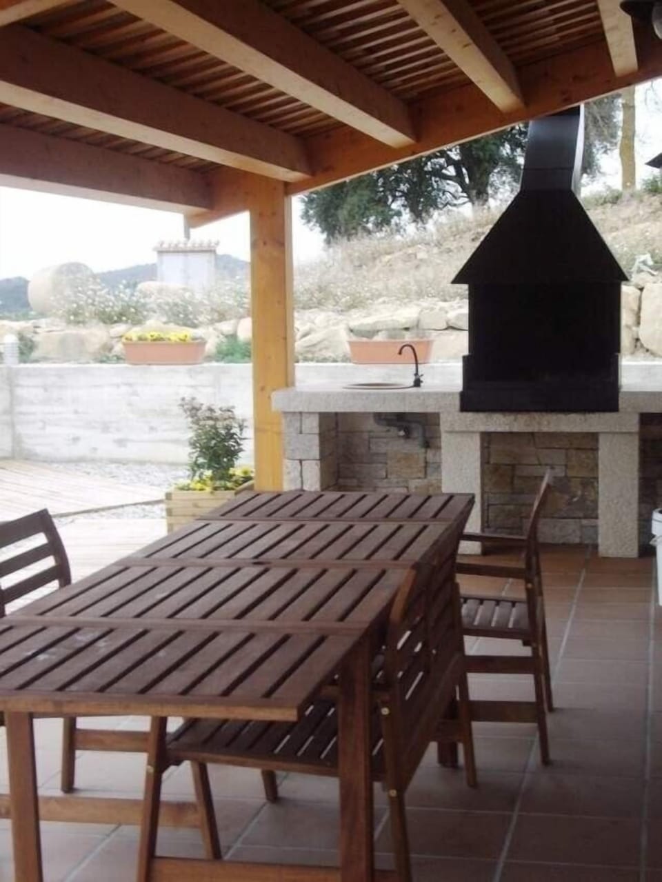 The covered terrace with  BBQ
