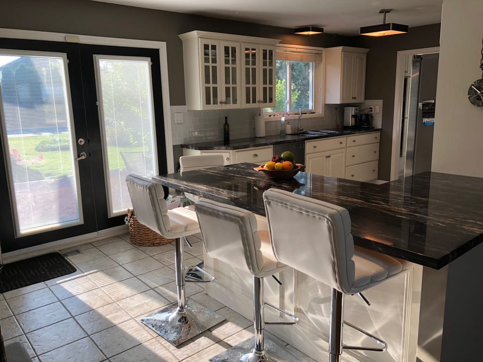 Large breakfast bar featuring 4 stools