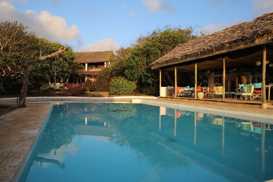 House and pool house from the pool
