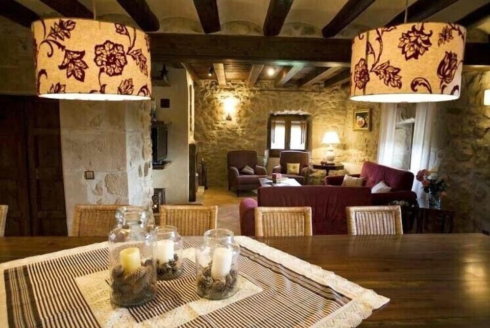 The dining room is connected to a cozy lounge area
