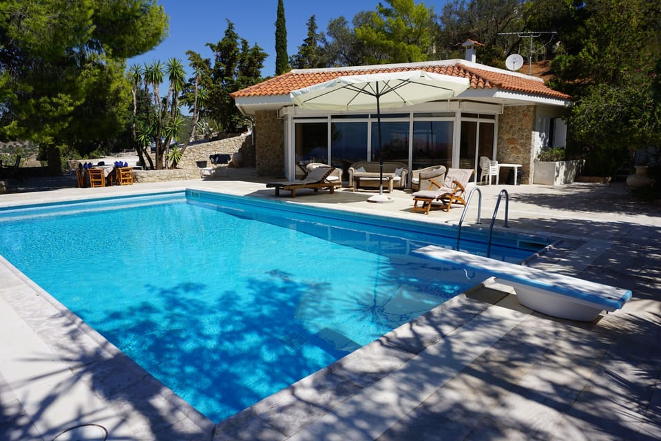 The pool house and its beautiful patio