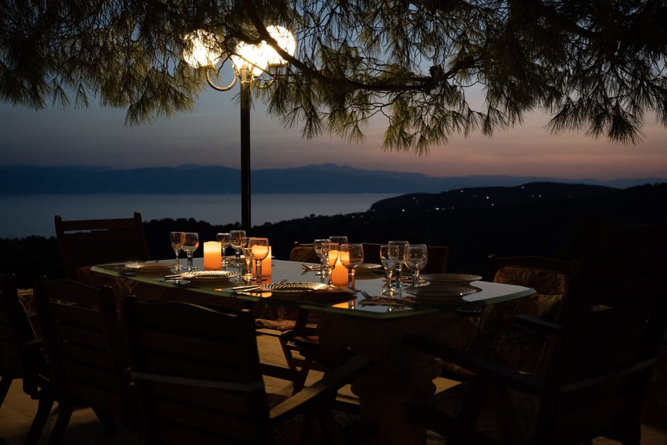 The dinning table in the pool house's patio at sunset