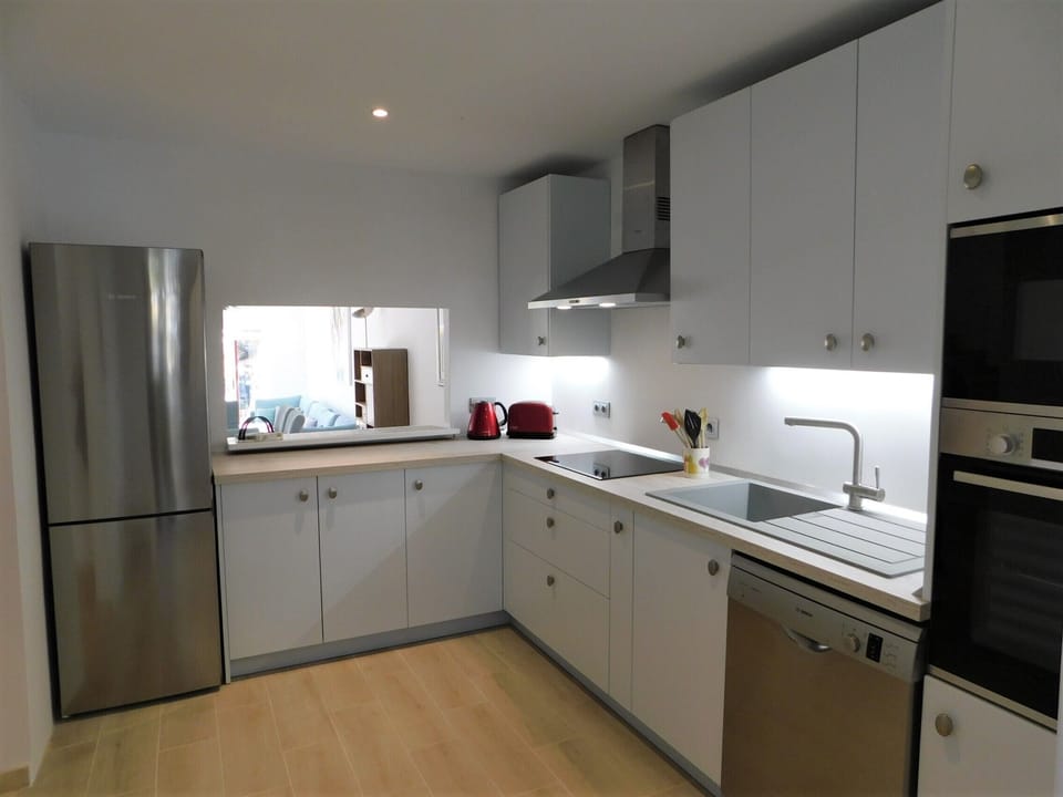 Fully equipped kitchen with modern fitted appliances
