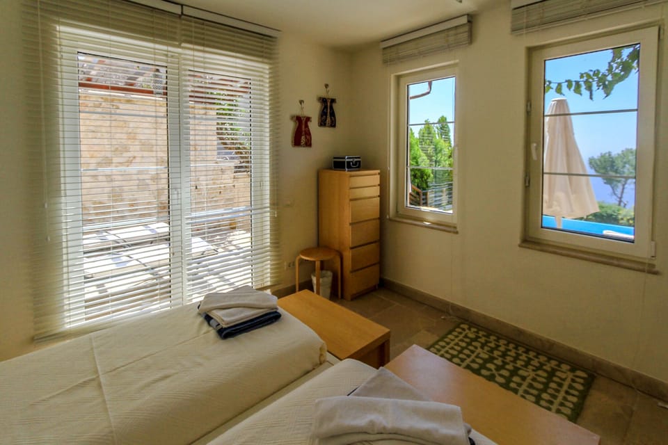 Twin room with access to the pool and patio area