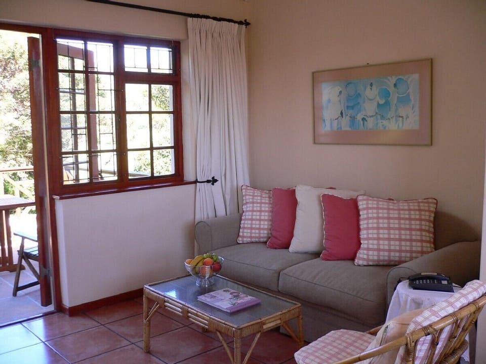 Living room opening onto private balcony