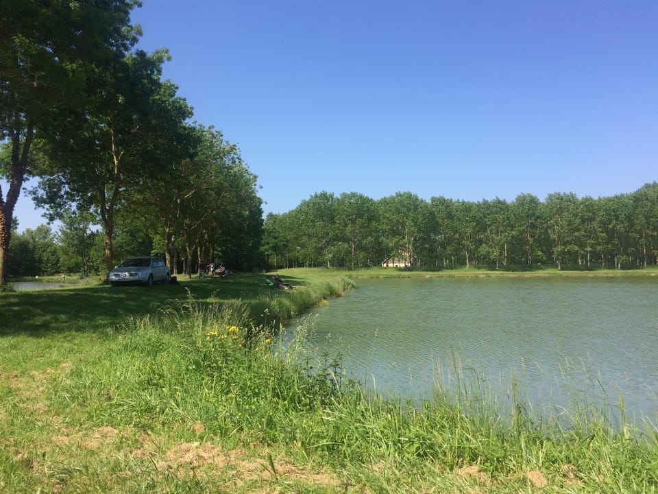 Fishermen on the little pond at the village entrance