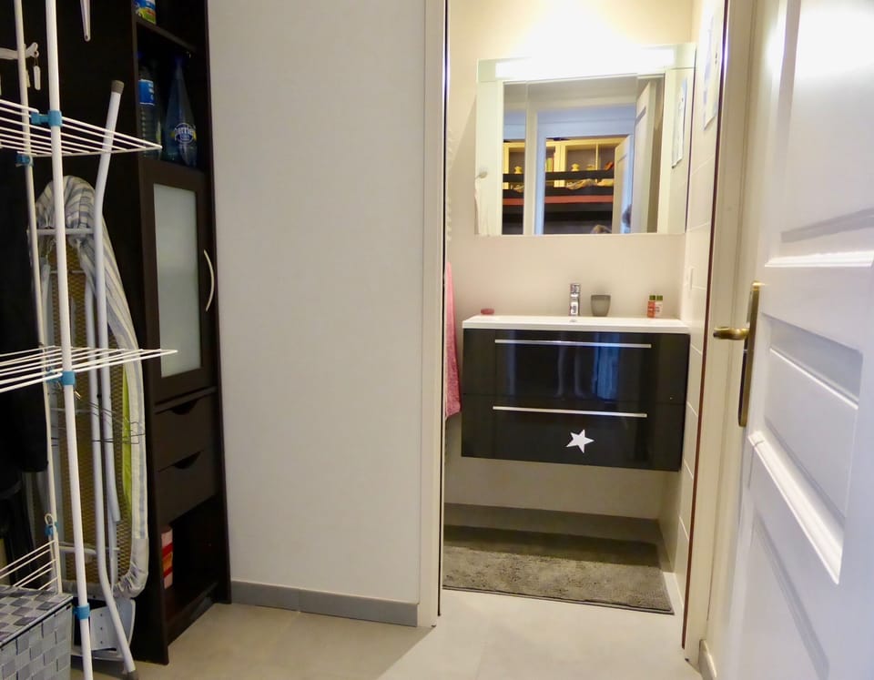 Bathroom with shower and laundry room