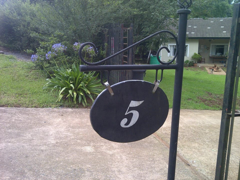 We are number 5 Tino road Hilton.  Your entrance is the next gate, also 5 but G