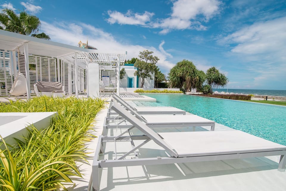 Poolside loungers with unobstructed seaview