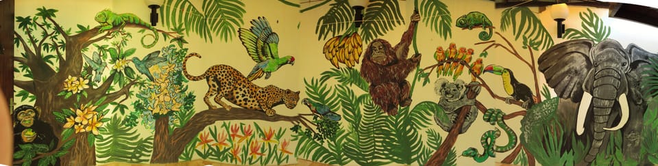 jungle mural in corridor leading to bedroom suite no 1 