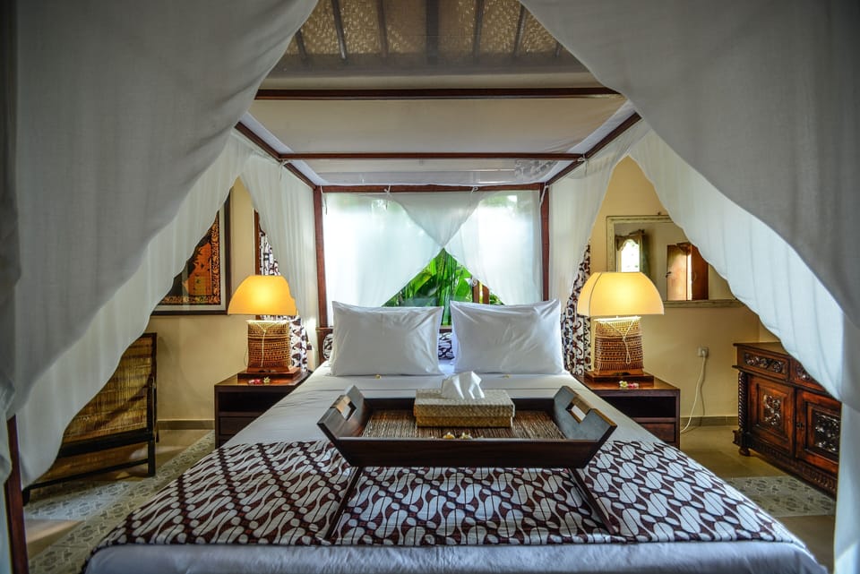 Four posted bed with batik.