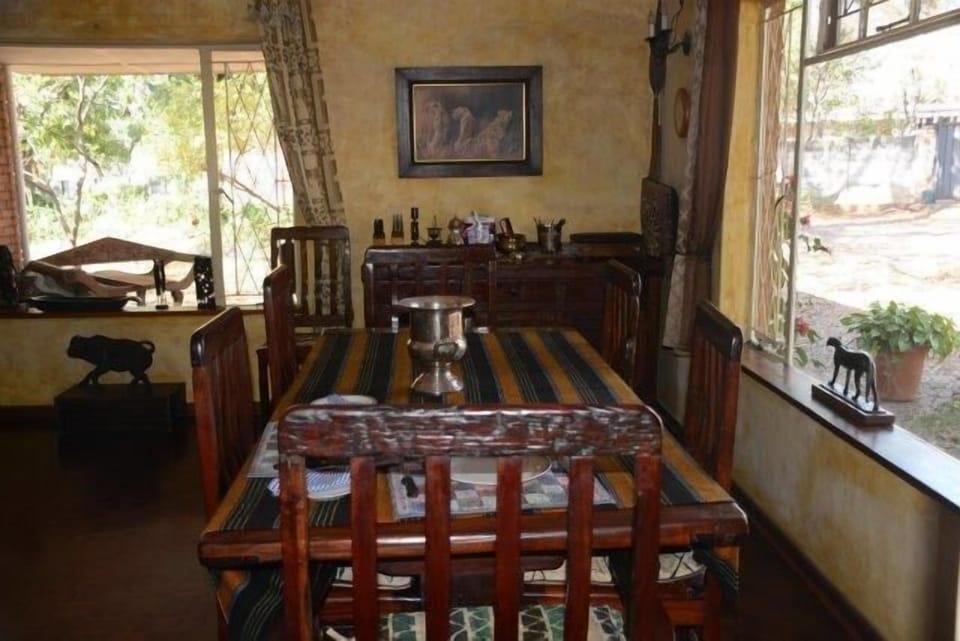 Dining room with Railway sleeper table and 8 seater