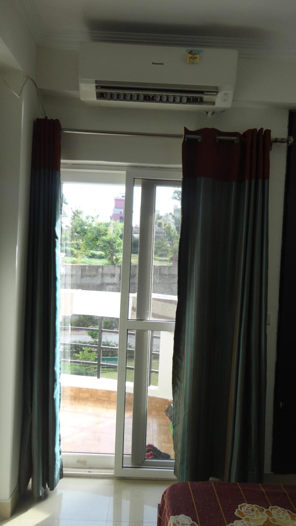 The apartment has a balcony to enjoy the hill and garden view along with sun