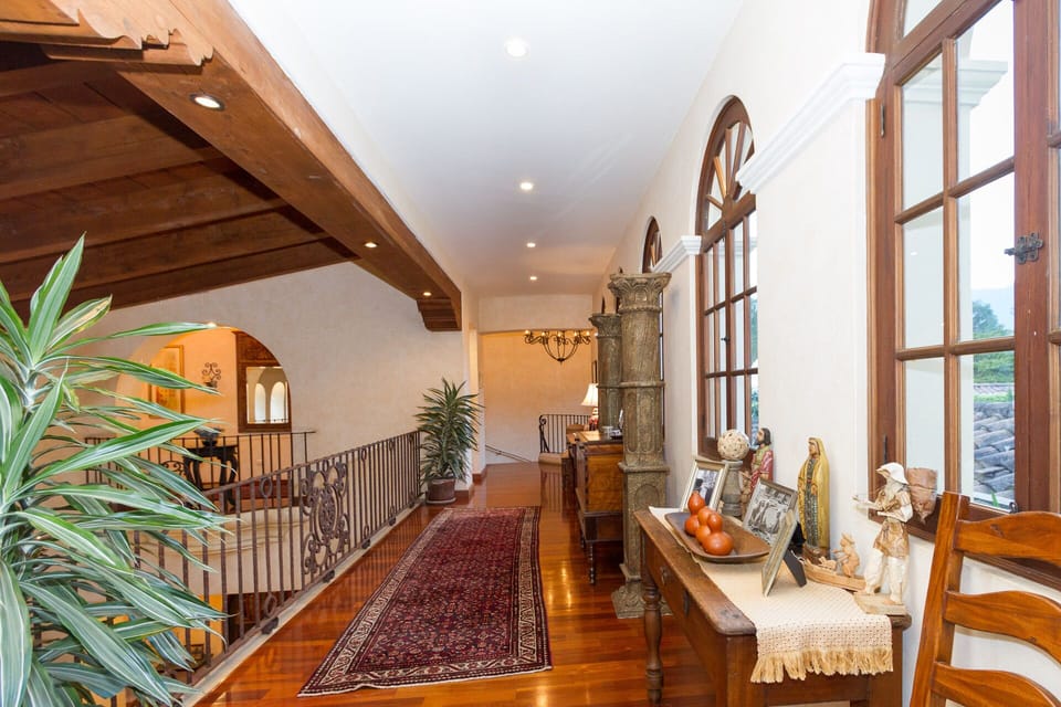 2nd floor hallway which overlooks the living area and separates the two wings.