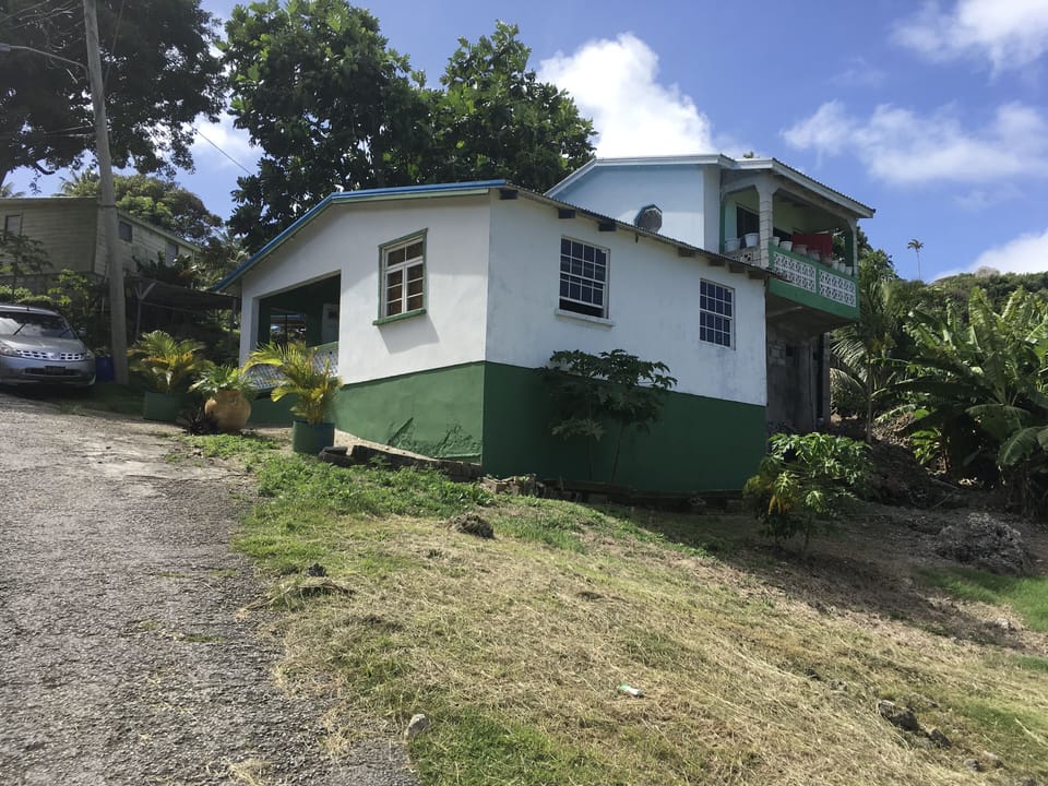 The elevated part of the house with the balcony is the apartment . 