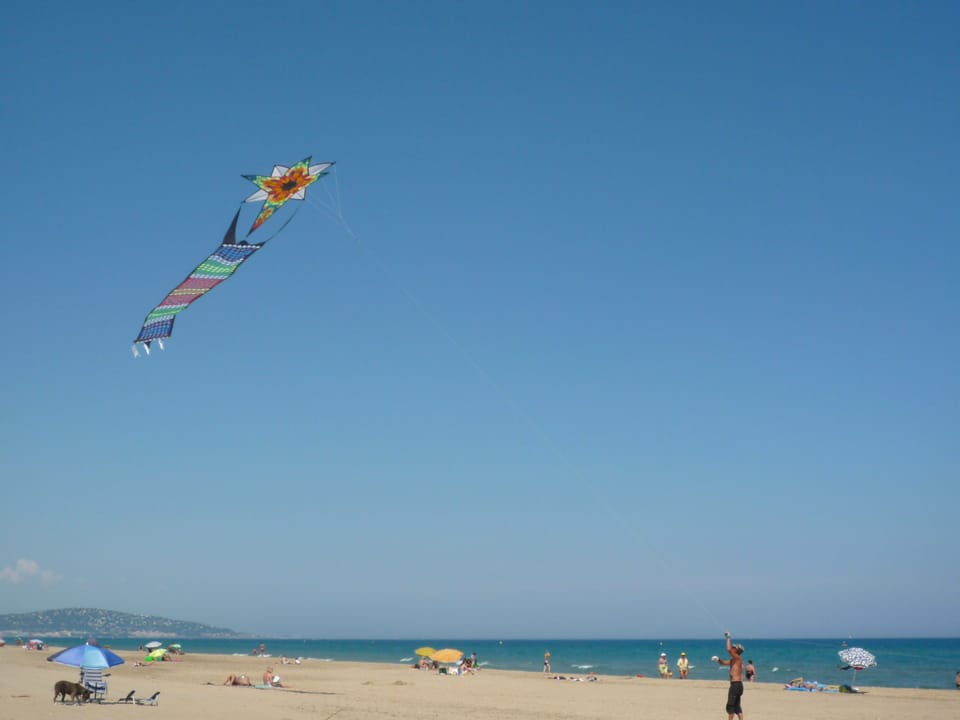 Marseillan Plage to Sete, miles of sandy beach along the blue Mediterranean sea