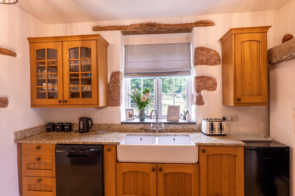 Kitchen with dishwasher, toaster, kettle and separate freezer