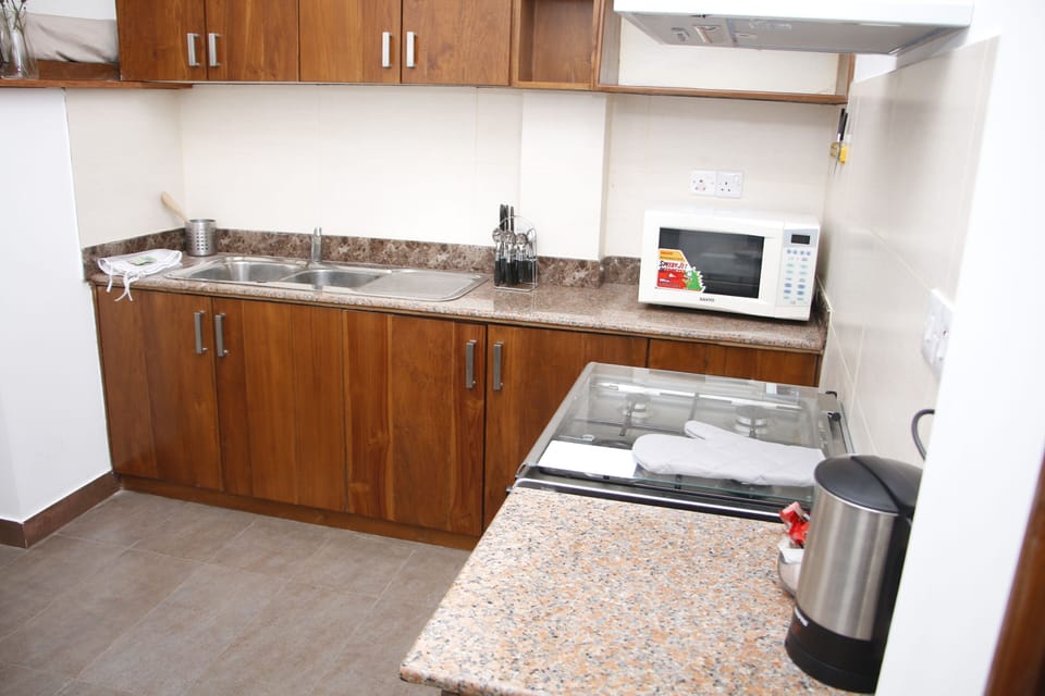 Pantry with Natural timber and granite tops