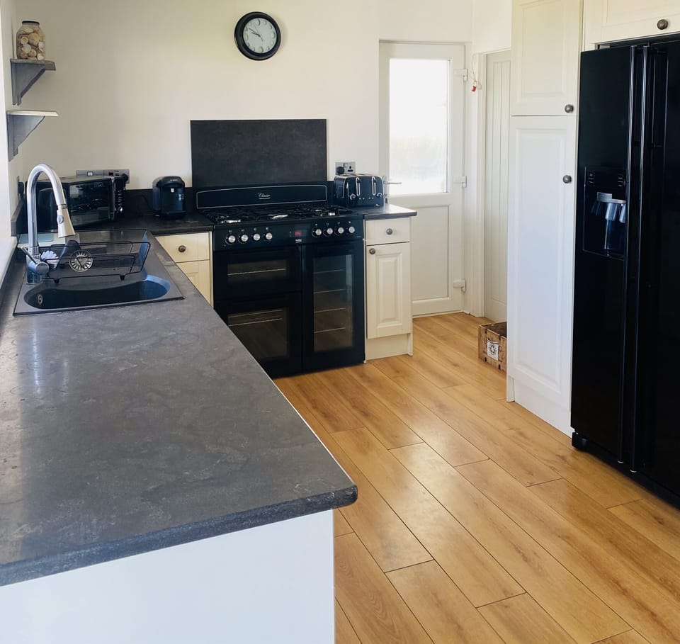 kitchen dinner with seating comprising of benches, dining chairs and a sofa
