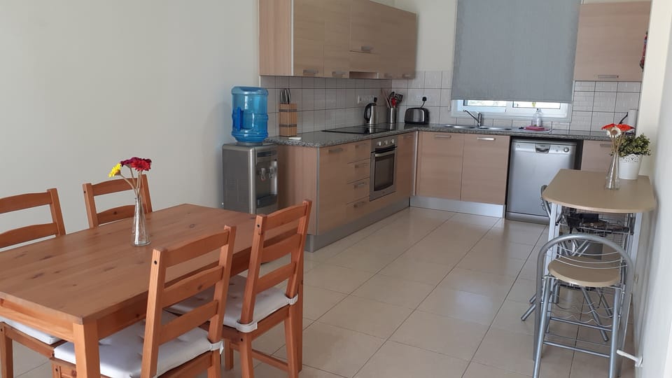 Open-plan kitchen with casual dining area.