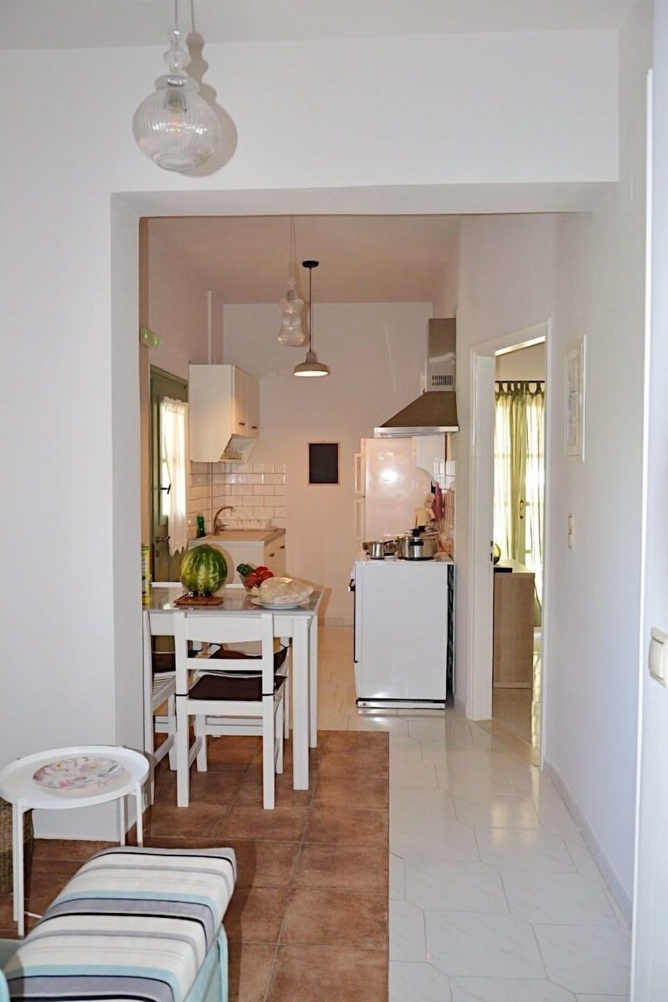 Kefalonia 2 bedroom apartment: kitchen with sink, stove, oven, dining table