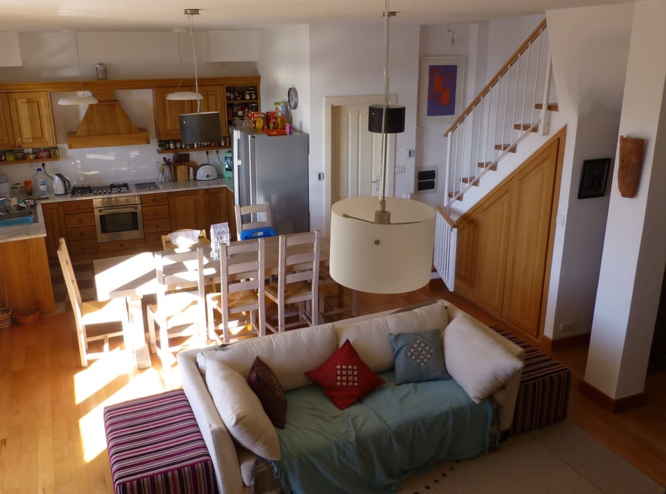 The open plan living room, dining area and kitchen