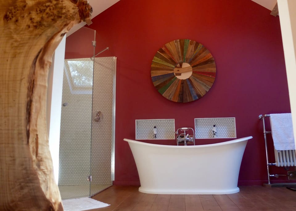 Ensuite master bathroom, his & hers sinks, walk in rain shower & roll top bat