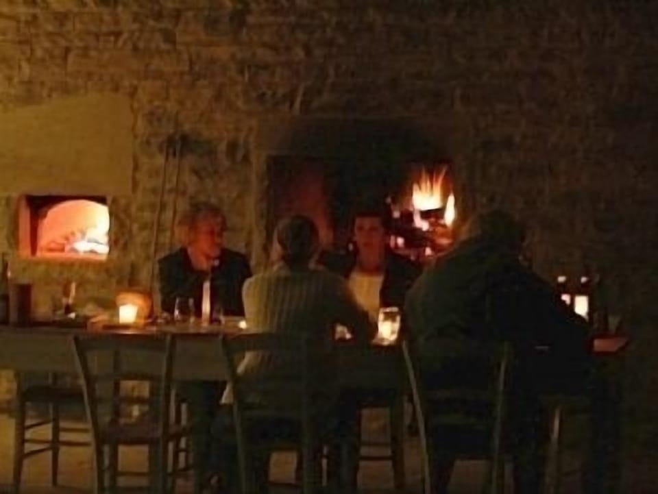 Outdoor dining with Pizza Oven and open fires