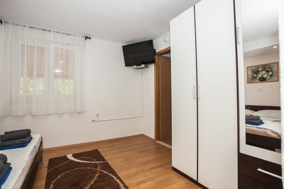 Separate room on the ground floor with satelite TV, wardrobe, and bathroom