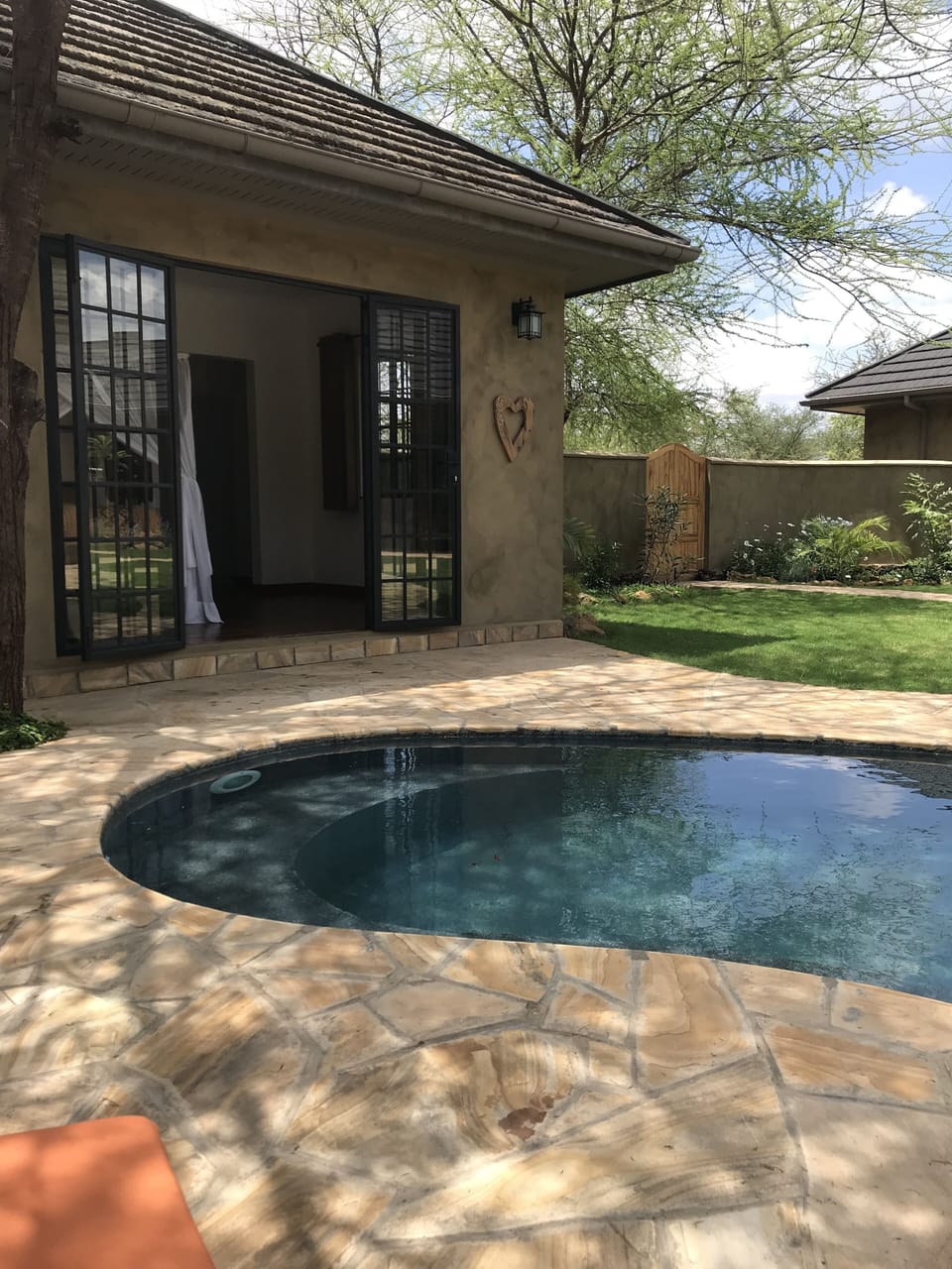 Swimming pool within courtyard and outside private ensuite bedroom