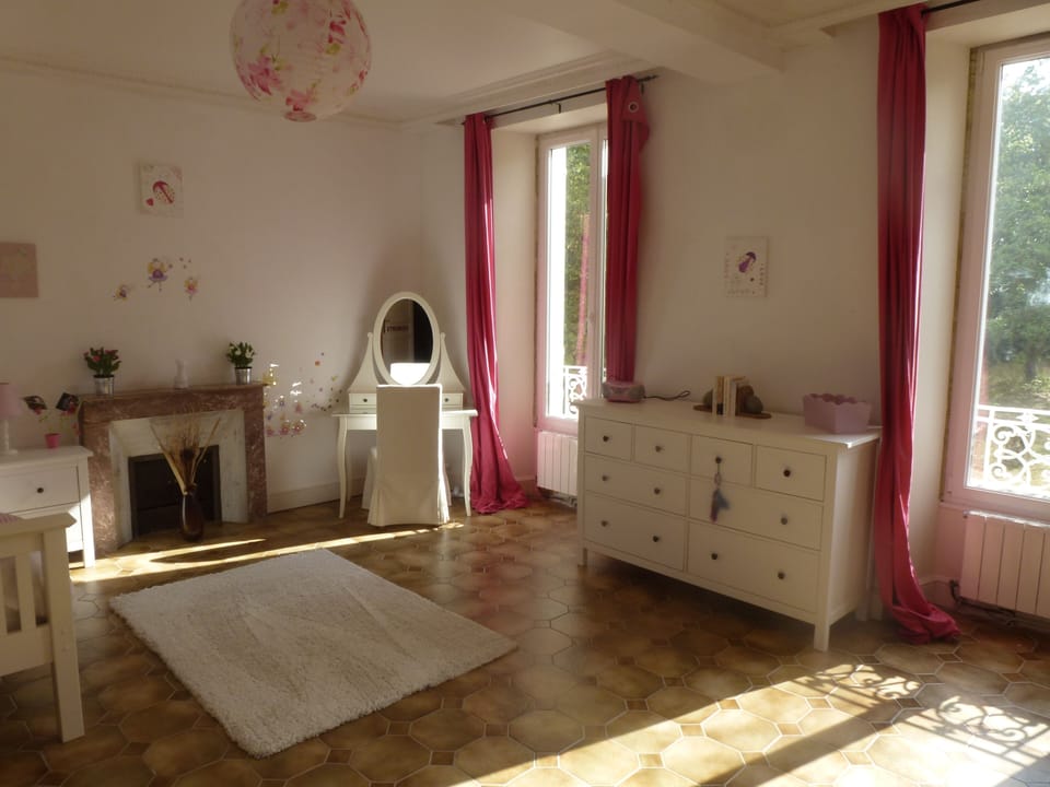 The master bedroom with king sized bed and wall speakers