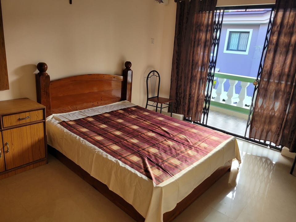 First bedroom with a balcony.
