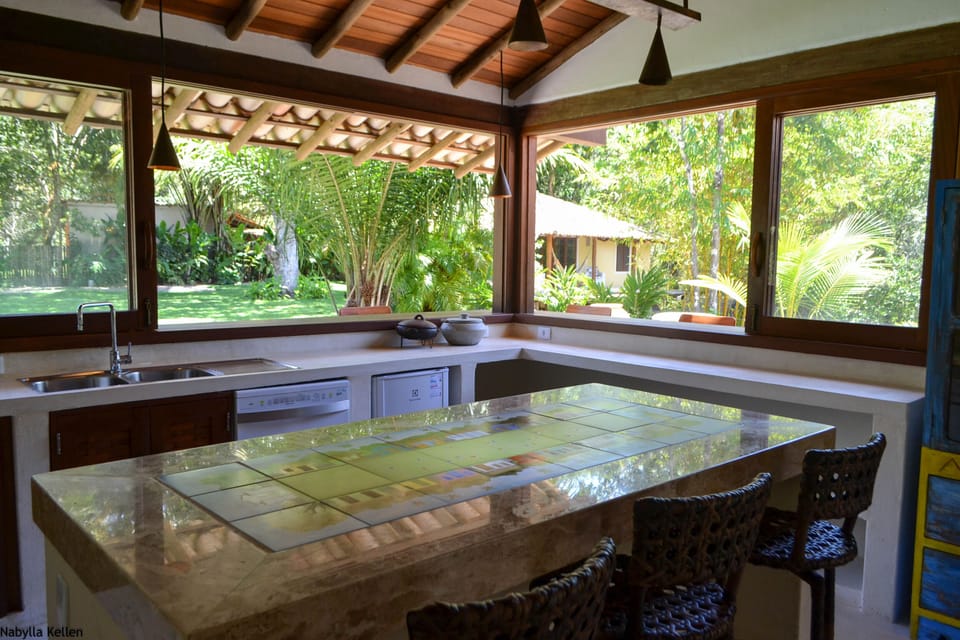 kitchen island with hand painted tiles by local artist