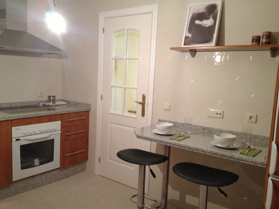 Fully stocked kitchen with integrated appliances 