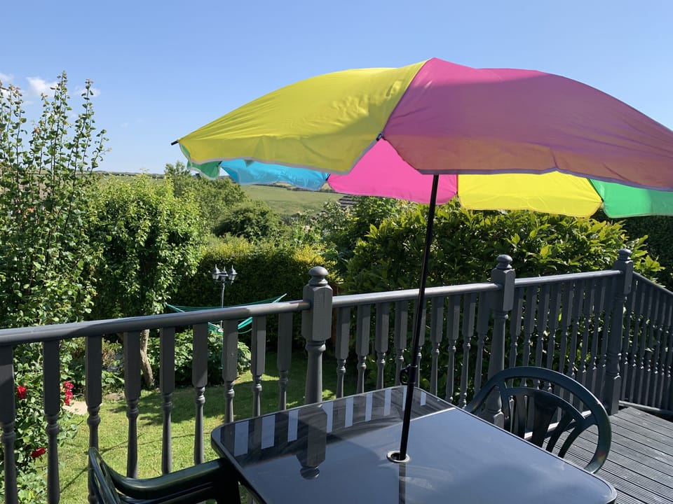 Outside Decked area from the patio doors overlooking the mature garden