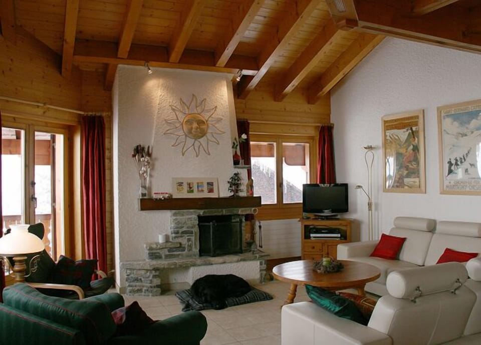 The open fireplace, satellite TV and beamed ceiling make the lounge super cosy