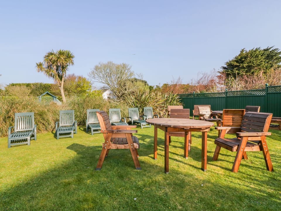 Garden with tables, chairs and sun loungers