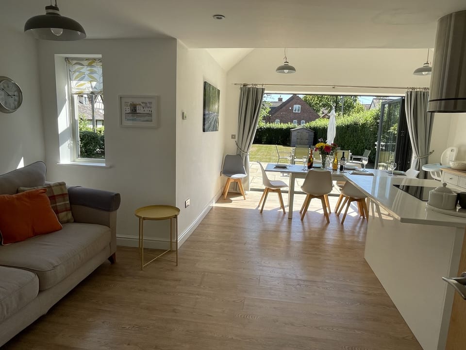 Open plan kitchen dinging with seating area