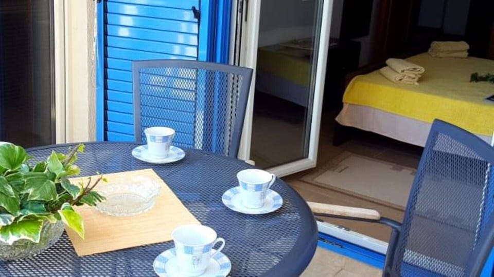 Balcony table with bedroom 