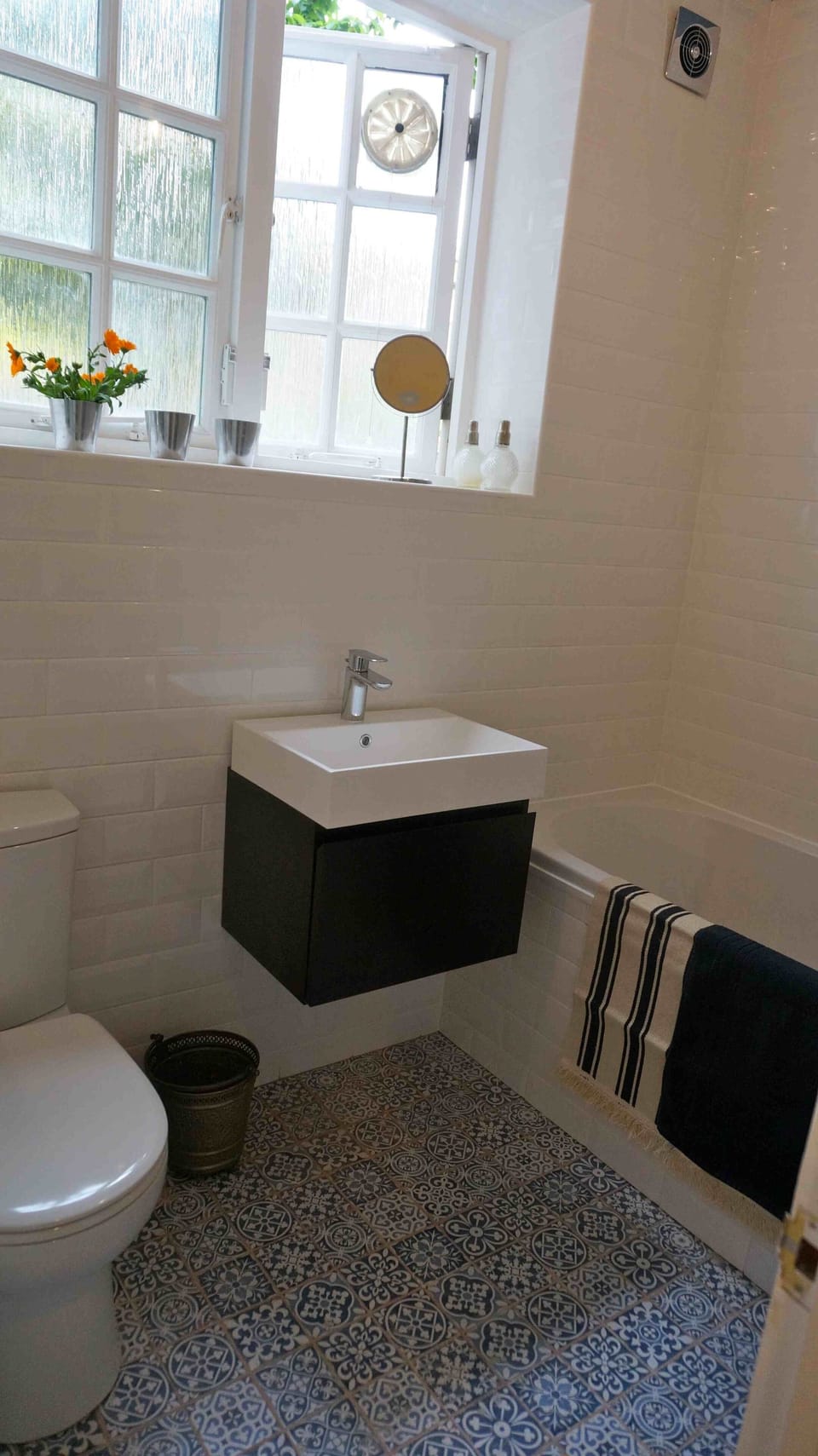 bathroom with power shower over bath