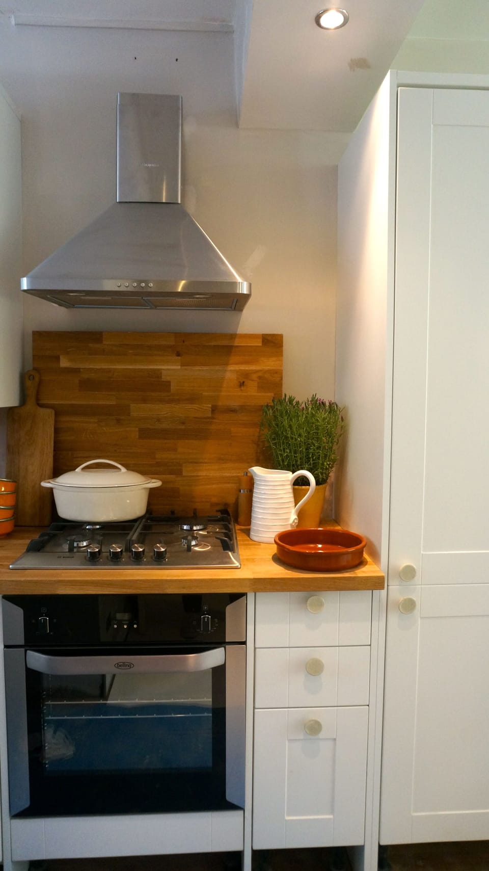 part of kitchen, fridge cupboard shown on right