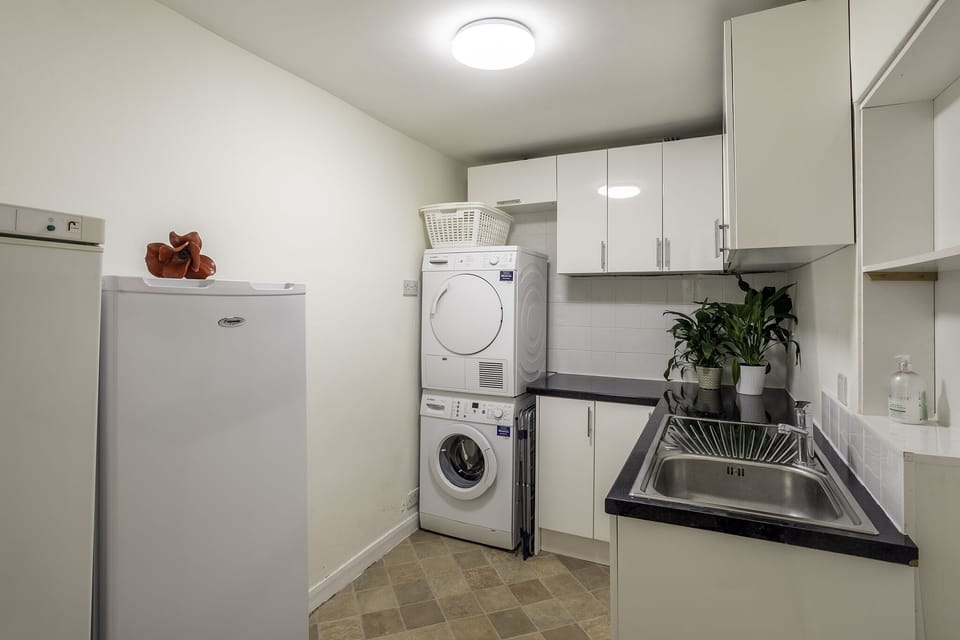 Utility room with extra fridge and freezer space and washer/dryer